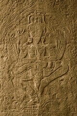 Fototapeta na wymiar Carvings on the walls of Angkor Wat Temples in Siem Reap, Cambodia