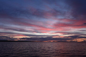 Fototapeta na wymiar Dramatic multicolored twilight sky in a moody weather