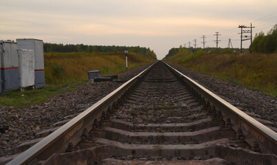 Fototapeta na wymiar railway tracks in the autumn landscape. time to travel. sit at home