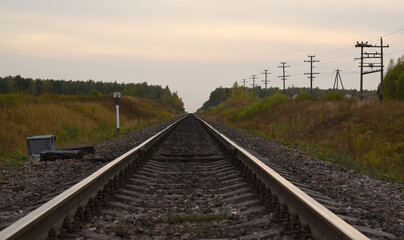 Plakat railway tracks extending into the distance
