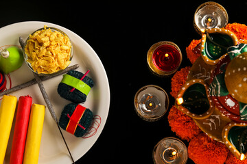 fire crackers,lamp and flower on dark background , Indian festival Diwali