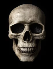 Tuinposter Scary human skull on a black background © Fyle