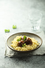 Pasta with homemade meatballs and parsley