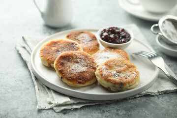 Traditional homemade cottage cheese cakes with berry sauce