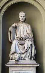 The statue of Italian and Florentine architect Arnolfo di Cambio, located in a niche in front of the  right side of Florence Cathedral. Florence, Tuscany, Italy