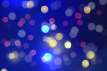 abstract background of blurred warm lights with cool blue.
