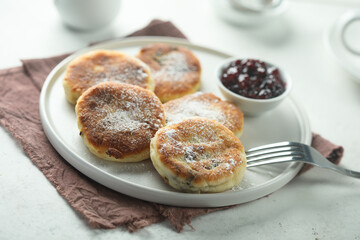 Traditional homemade cottage cheese cakes with berry sauce