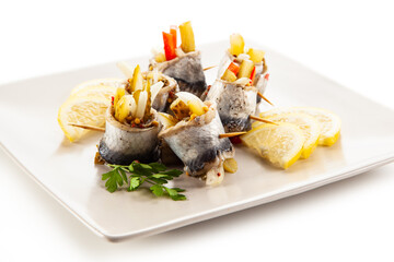 Marinated herring fillets on white background
