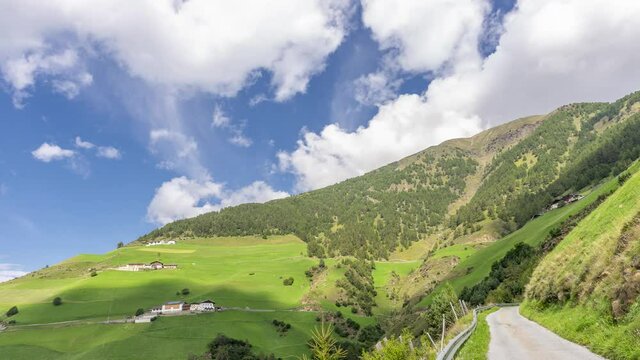 The Venosta Valley above Silandro, South Tyrol, Italy, on a beautiful sunny day with passing clouds. Time lapse Motion
