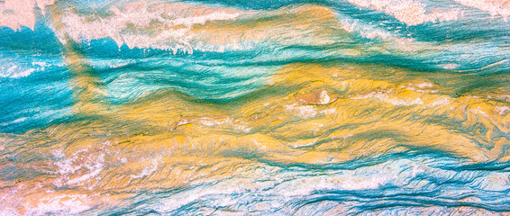 Rock layers - a colorful formations of sedimentary rocks stacked over the hundreds of years. Abstract background with fascinating texture for graphic design.
