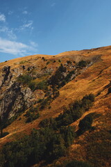 hill view. grassy mountainside. rise in height