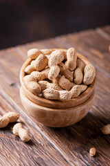  Roasted peanuts in wooden bowl