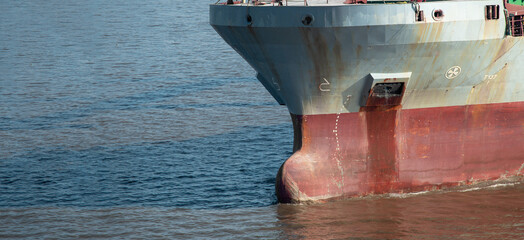 Closeup of multipurpose ship bulbous bow underway.