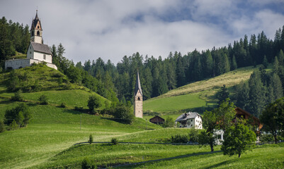 La Val village and its surrounding churches, Alta Badia, Dolomites, South Tirol, Italy.