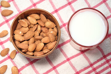  almond nut and milk on table top down