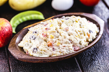 mayonnaise with vegetables, Brazilian tradition. Mayonnaise with corn, lentils, tomatoes, eggs and raisins.