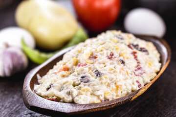 mayonnaise with vegetables, Brazilian tradition. Mayonnaise with corn, potatoes, lentils, tomatoes, eggs and raisins. Brazilian garrison for parties and events