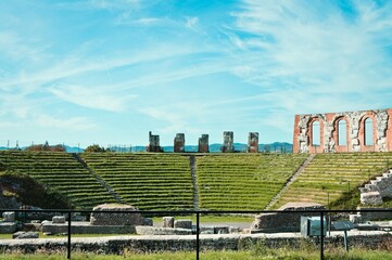 The ruins of an ancient Roman amphitheater in the Umbrian countryside (Gubbio, Marche, Italy)