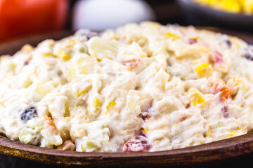 mayonnaise with vegetables, Brazilian tradition. Mayonnaise with corn, potatoes, lentils, tomatoes,...