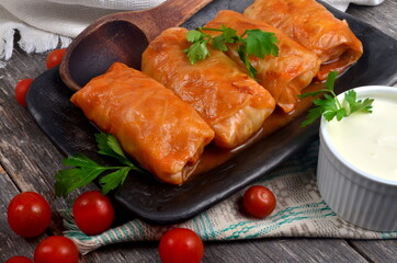 Cabbage rolls stuffed with ground meat and rice. Delicious homemade stuffed cabbage leaves with meat, rice and spices