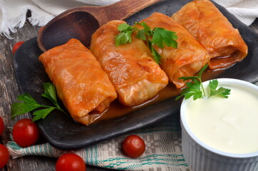 Cabbage rolls stuffed with ground meat and rice. Delicious homemade stuffed cabbage leaves with meat, rice and spices