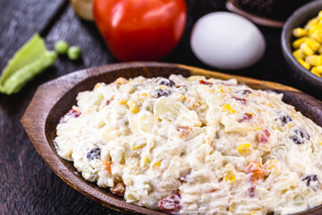 Brazilian mayonnaise, with fruits and vegetables, rustic kitchen, wooden utensils in the background
