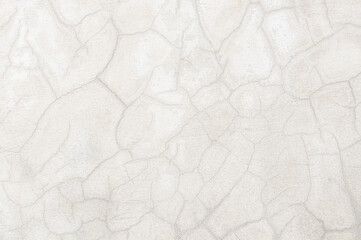 abstract of cement cracked texture on old white masonry wall
