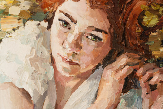 Portrait of young beautiful red-haired girl with blue eyes on a ocher background. Oil painting on canvas..