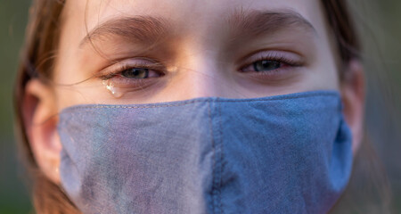 girl crying with a mask