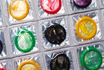 Colorful condoms background.