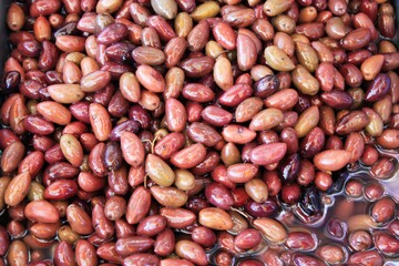 Stall with Kalamata or Kalamon olives at street market in Athens, Greece.