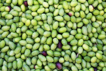 Stall with green olives at street market in Athens, Greece.