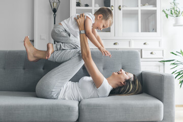 Mother and son on a sofa in their living room