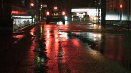 Fototapeta na wymiar Way or Road Reflecting Lights on A Rainy Day, Traffic Image with Cars