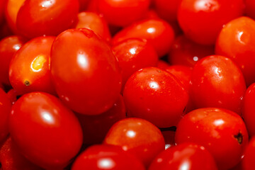 Cherry tomatoes stacked on a white plate