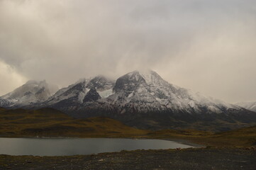 Hiking around the dramatic and windy mountain landscapes of Torres del Paine in Patagonia, Chile