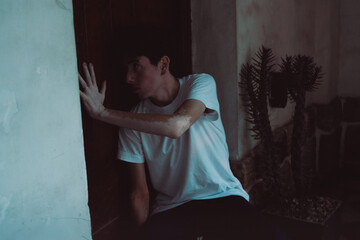 vitiligo, young man leaning on a door, home sweet home, health concept, aid campaign, mental health...