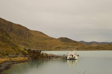Hiking around the dramatic and windy mountain landscapes of Torres del Paine in Patagonia, Chile