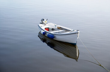 Naklejka na ściany i meble Boat in sea water for tranquility calm peace and mindfulness