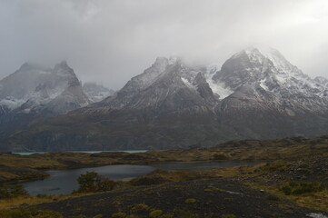 Fototapeta premium Hiking around the dramatic and windy mountain landscapes of Torres del Paine in Patagonia, Chile