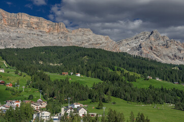 Fototapeta na wymiar La Varella mountain with Forcela [Pass] de Medesc, Dolomites of Fanes-Senes-Braies mountain park, above Val Badia [valley], seen from Pedraces village, Badia village, South Tirol, Alto-Adige, Ital