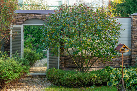  view on garden near russian dacha -  mirror (landscape design technique )in wall.