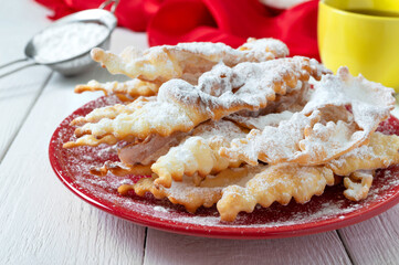 Brushwood - crispy deep fried cookies in powdered sugar with tea and jam. A traditional treat at...