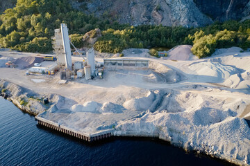 Quarry works industrial digging aerial view from above showing sand mound and hills