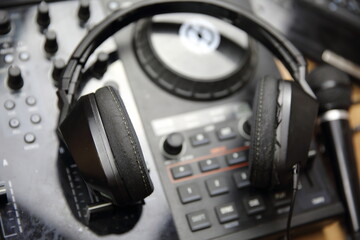 Obraz na płótnie Canvas Party DJ headphones and turntable deck. Digital audio equipment for music concert in nightclub