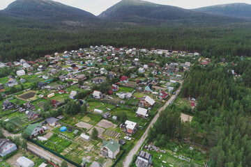 Fototapeta na wymiar Aerial Townscape of Suburban Village Cheremushki located in Northwestern Russia on the Kola Peninsula near the town Kandalaksha