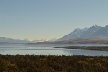 Hiking around the dramatic and windy mountain landscapes of Torres del Paine in Patagonia, Chile
