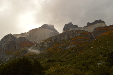 Hiking around the dramatic and windswept mountain landscapes of the Torres del Paine National Park in Patagonia, Chile