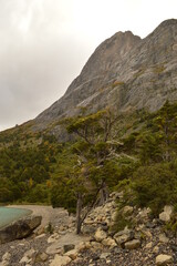 Hiking around the dramatic and windswept mountain landscapes of the Torres del Paine National Park in Patagonia, Chile