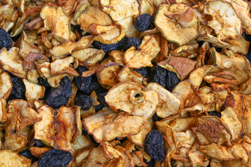 Dried fruits in bulk. Dried apples and plums.